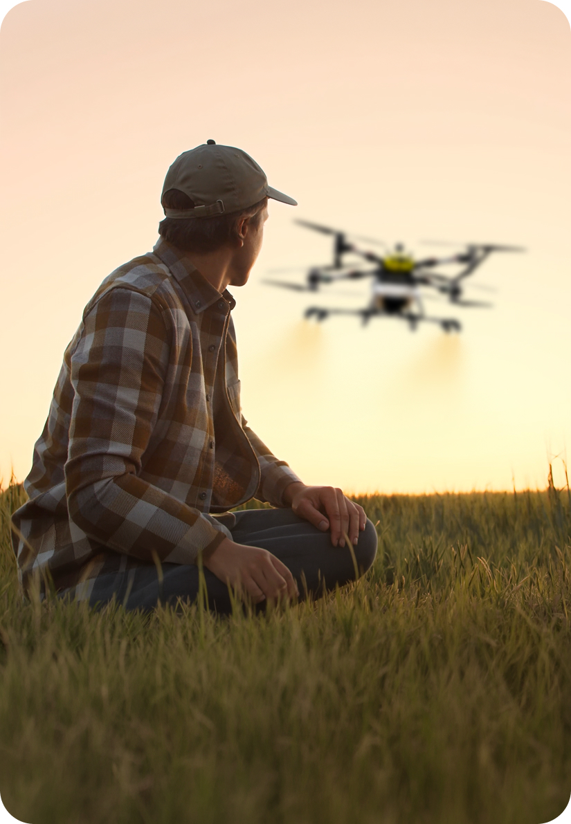 Agricultural drone spraying a field